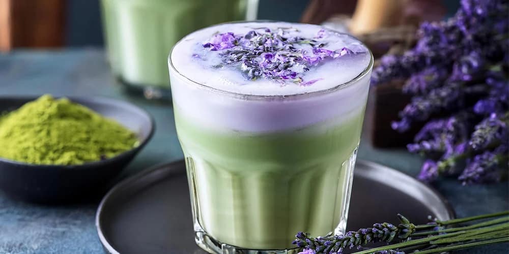 Creamy lavender-infused Iris Matcha Latte served in a ceramic cup with soft, calming tones