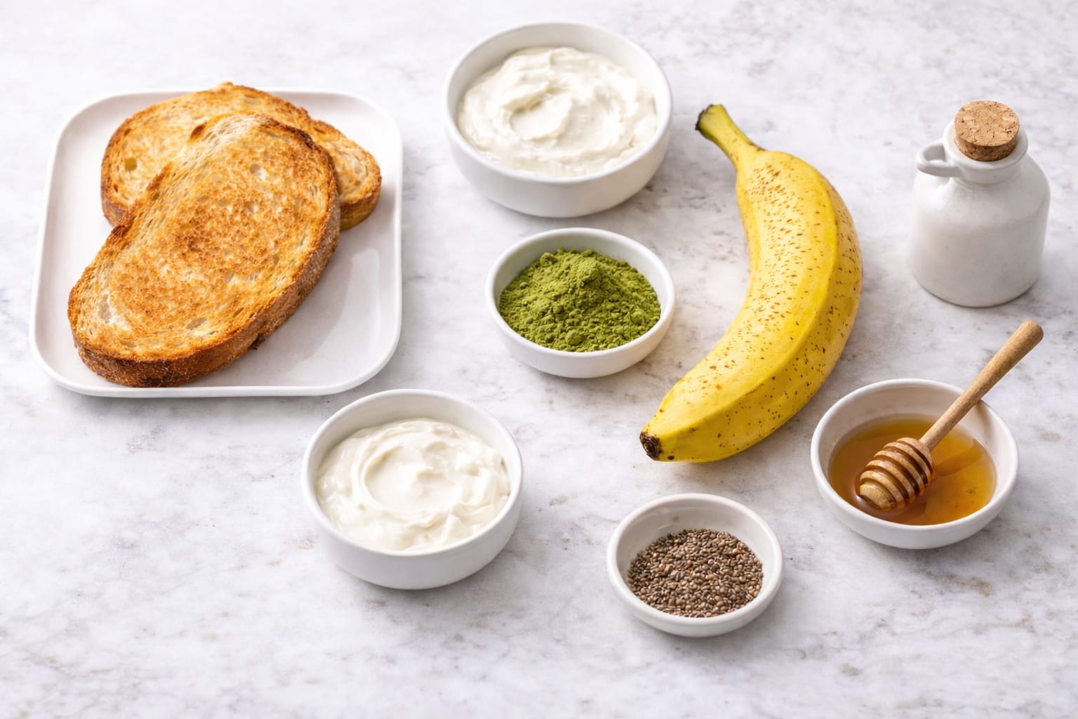 Ingredients for matcha banana toast including ripe bananas, matcha powder, yogurt or cream cheese, honey, and toasted bread