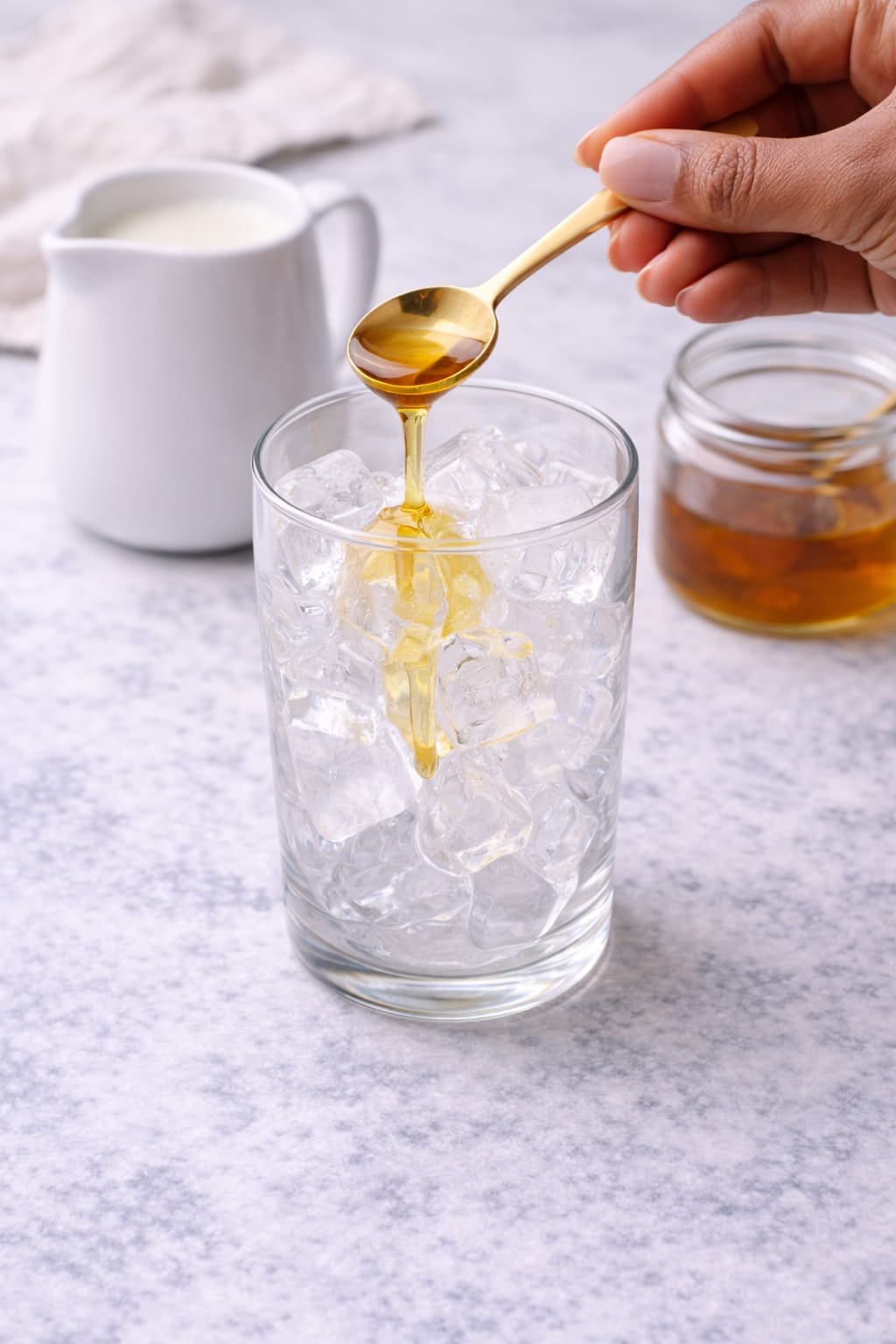 Step 3: Ice in a tall glass with sweetener for an iced matcha latte