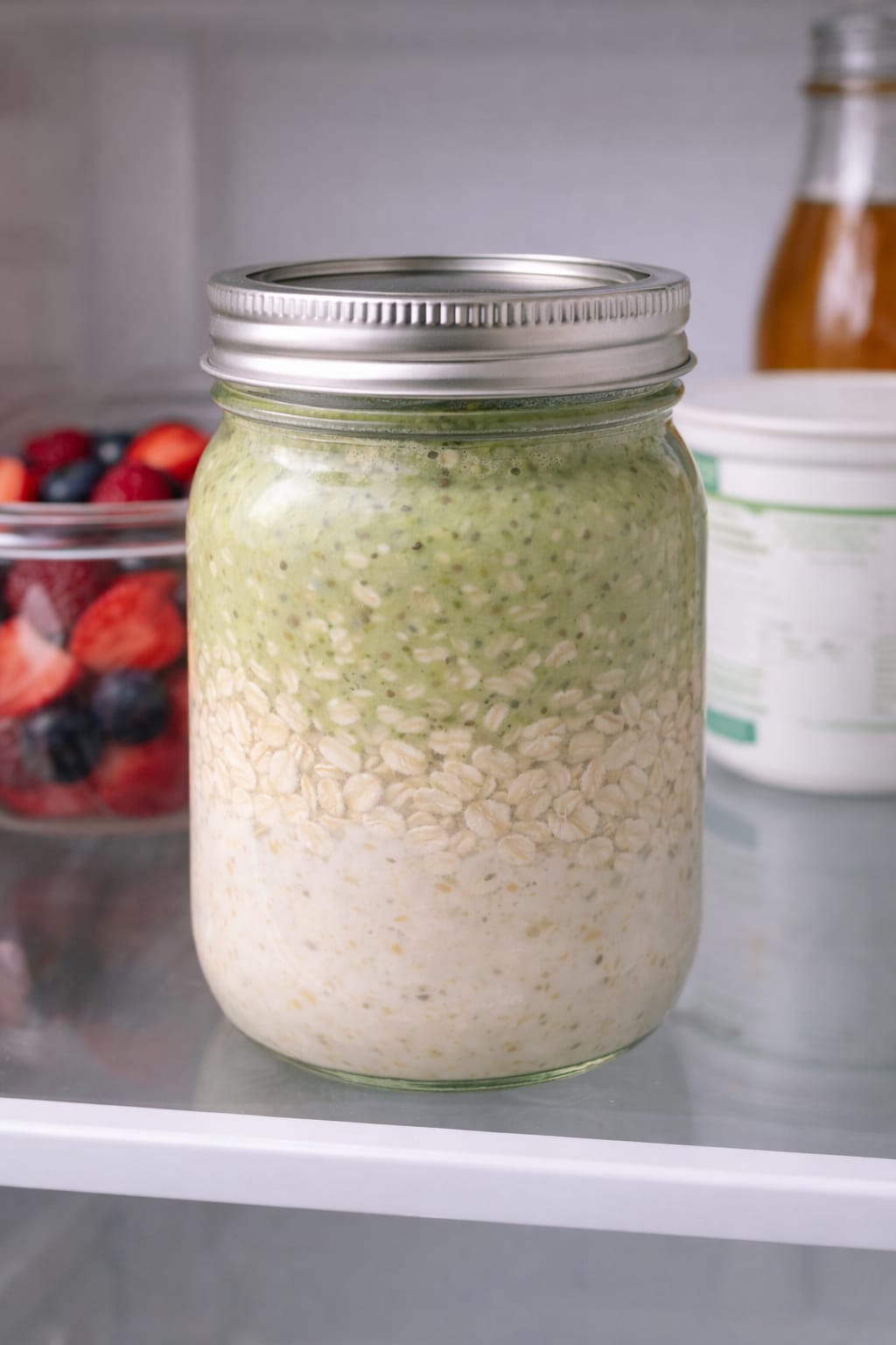 Step 4: Covered jar of matcha overnight oats chilling in the refrigerator