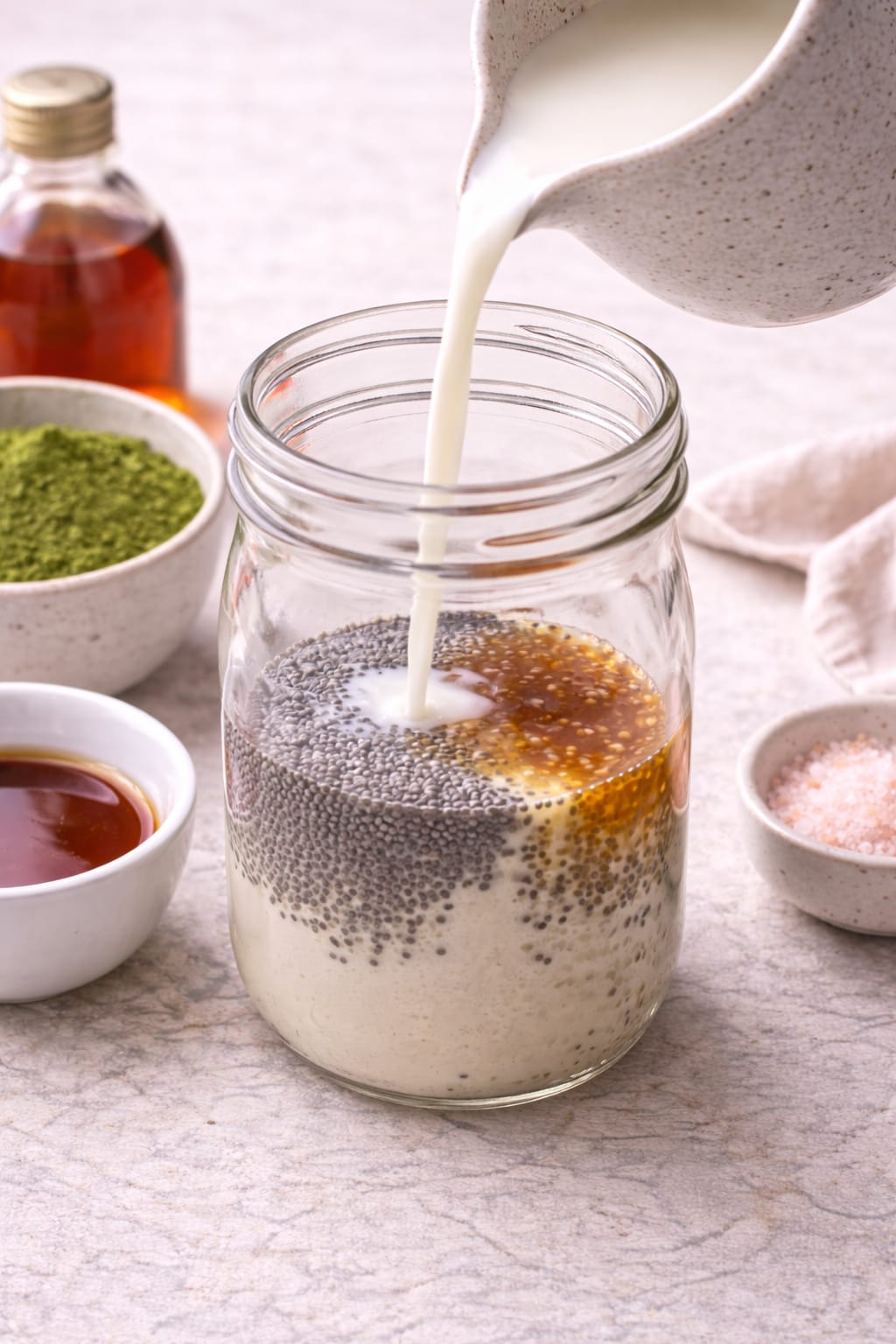 Step 2: Adding chia seeds and milk to a mason jar