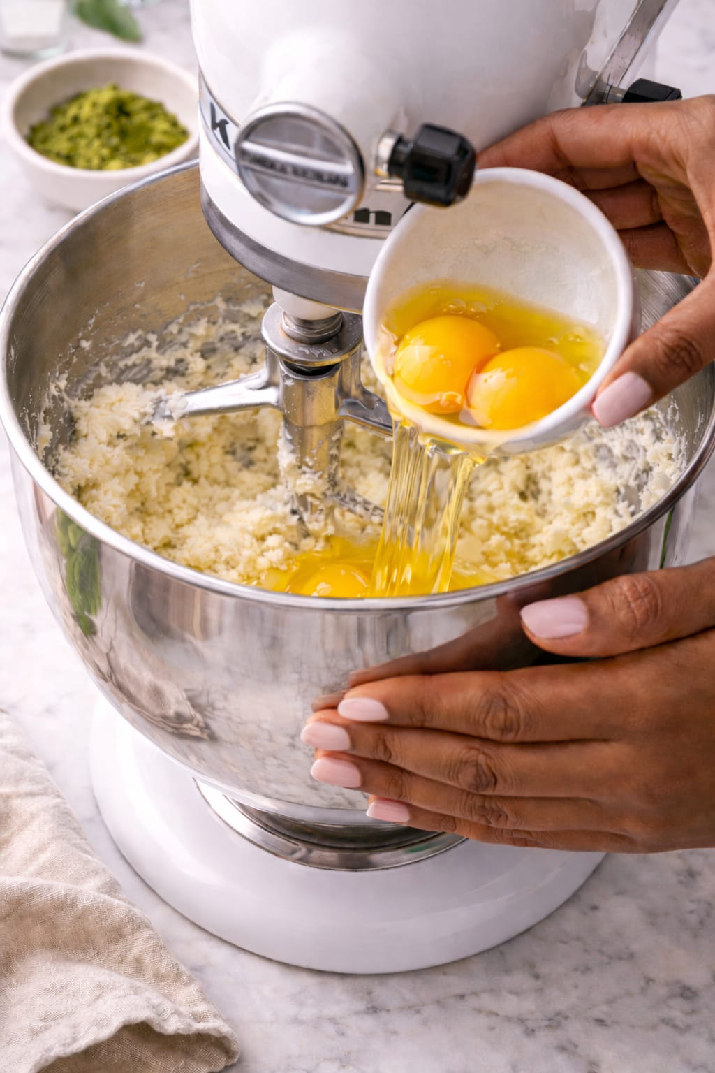 Adding eggs to matcha pound cake batter