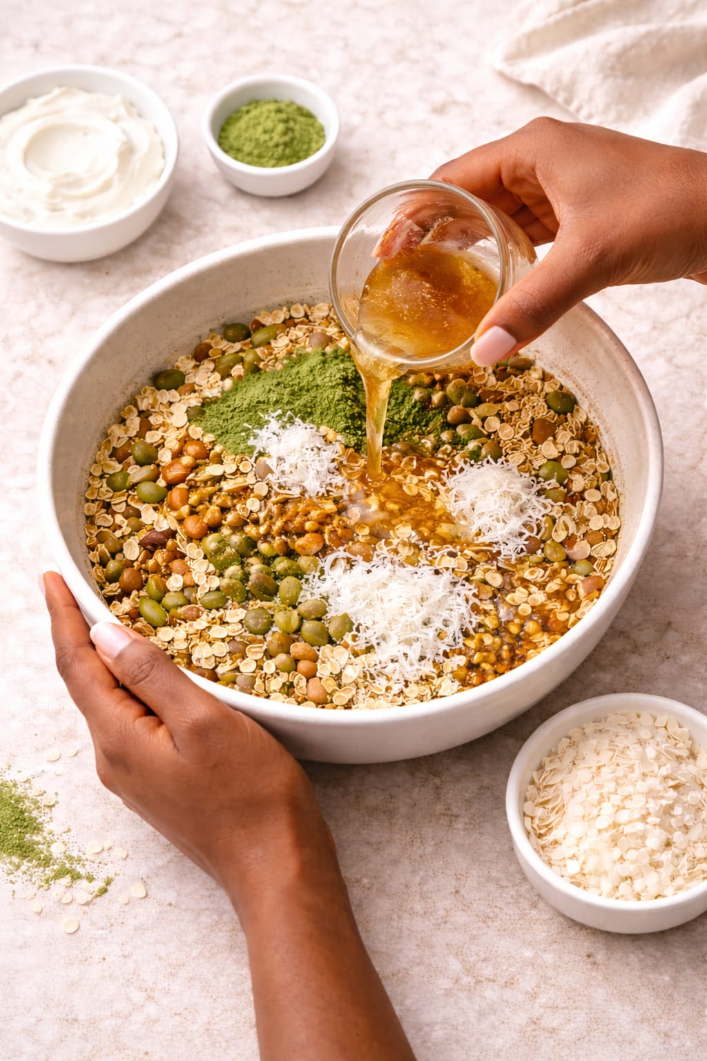 Step 3: Pouring honey mixture over oats for matcha granola