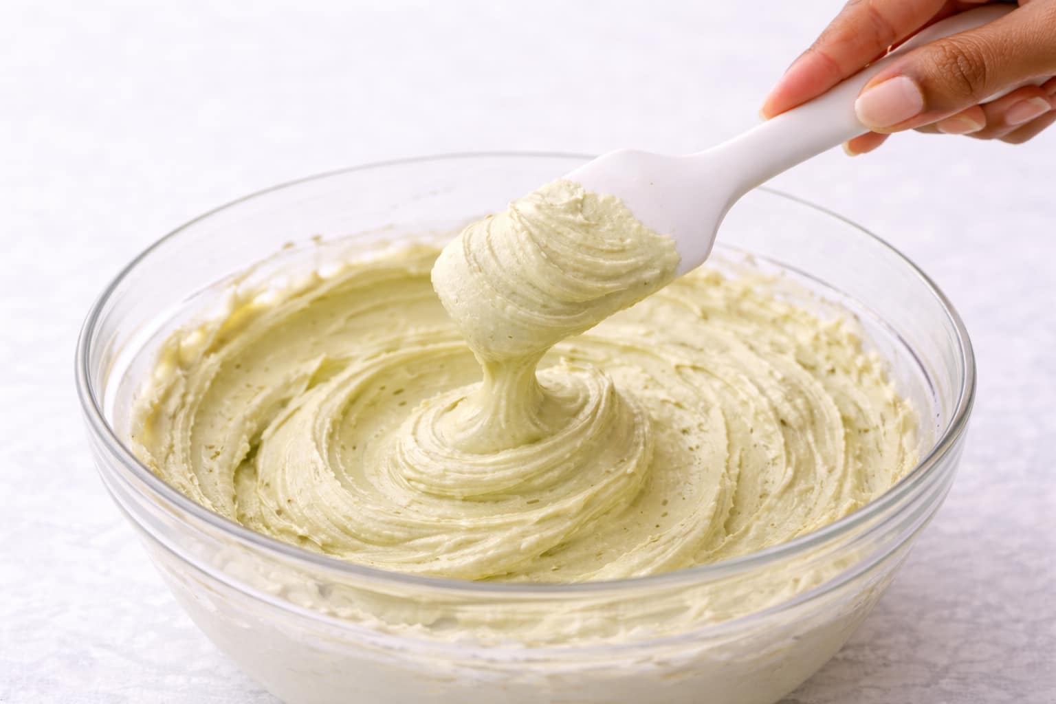 Step 5: Adjusting frosting consistency until smooth and fluffy